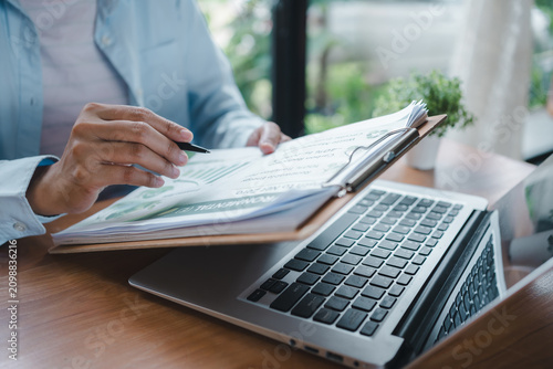 Photos ESG report corporate compliance reporting concept close up hands typing on lapto