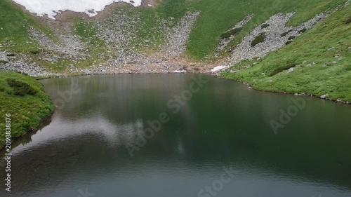 Aerial drone view of alpine mountain lake in Carpathian highlands