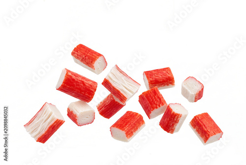 Crab sticks isolated on white background. Fresh surimi pieces for sushi and seafood salads.