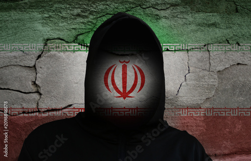 фотографія Conceptual image of a person in a black hoodie with an obscured face, overlaid w