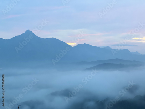 mountain landscape with clouds and fog
