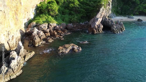 aerial view of rocky coastline and blue sea