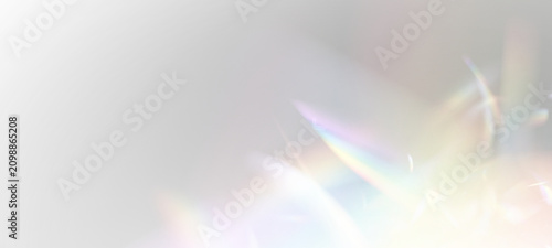 Soft rainbow bokeh lights float on a transparent background. Crystal reflections create a dreamy atmosphere. PNG overlay element for creative editing.
