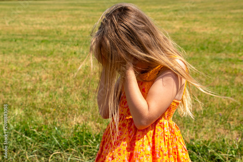 Little girl crying covering face hands, childhood grief, emotional distress, vulnerability parental support, Mental health safety for children, outdoor family crisis, authentic moment, family vacation