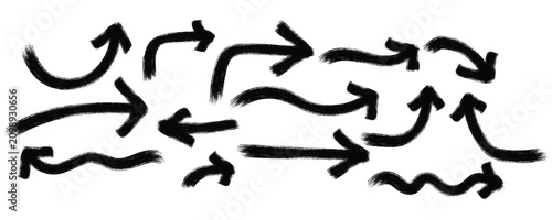 Set of hand drawn black arrows pointing in different directions for design and navigation Vector