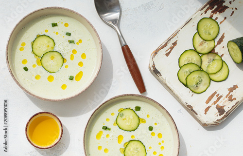 Cold cucumber yogurt soup bowls white flat lay summer natural light top view