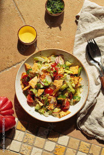 Fattoush summer salad terracota tile bright sunlight Mediterranean Middle east Lebanese