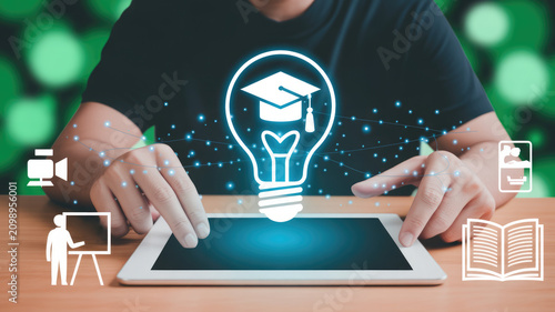 Digital education concept featuring an interactive tablet with glowing graduation cap lightbulb with data
