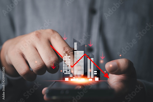 Real estate market decline concept with financial downturn graph, property investment crisis, urban economy recession, housing market loss and business risk analysis on digital mobile interface.