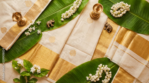 onam kerala kasavu saree traditional clothing jasmine flowers background festival with gold textiles jasmine banana leaves and brass decor for fashion campaigns cultural greetings and festival banners