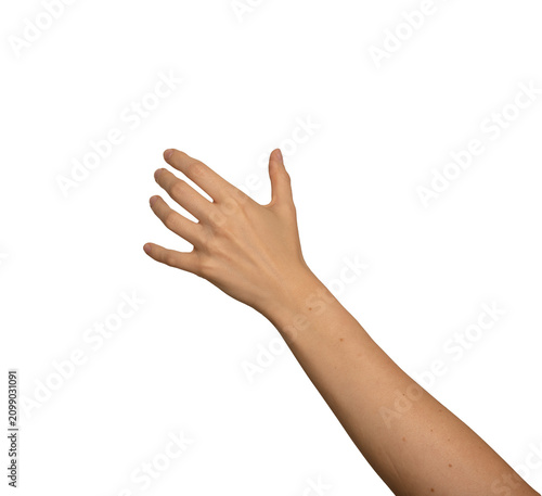 Female left hand grips something large and invisible. Fingers spread wide to hold an unseen bulky