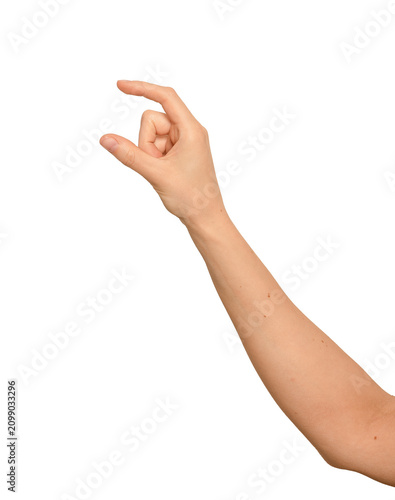 Female right hand pinches thumb and index finger apart. Digits hold something small and invisible