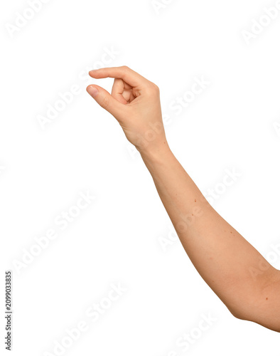 Female right hand stretches thumb and index apart. Fingers hold something tiny and invisible between