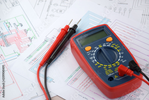 The digital multimeter electrical engineering drawings, circuit breaker and pencils