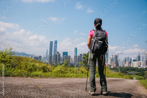 Photography Woman hiking on mountain top in Hong Kong