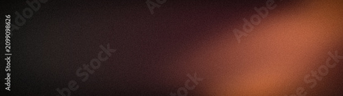 Фотография Abstract grainy textured background design in black brown and burnt orange with