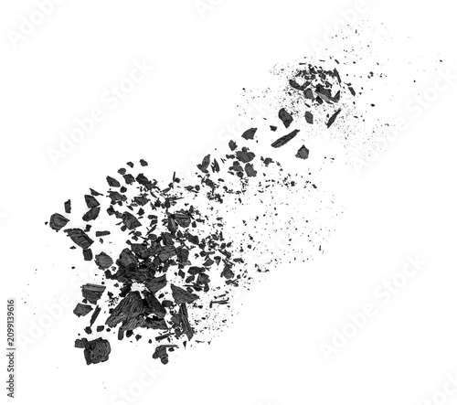 Obraz na plátně Black charcoal dust scattered on a white background, top view