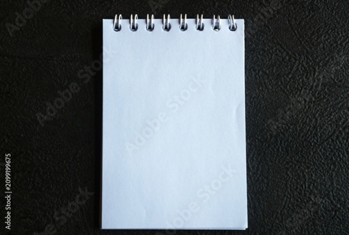 Fotografie This spiral bound notebook is known as a memo pad or mini notebook
