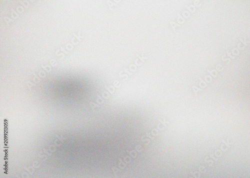 Minimalist light gray textured gradient with subtle dark smudges offering a clean versatile abstract design element