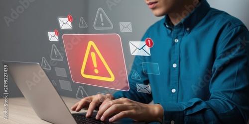 Person working on laptop with digital warning signs and email notifications transparent background