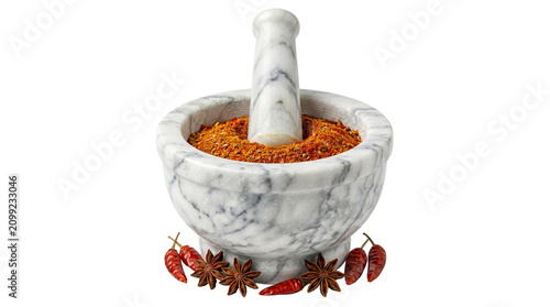 Cuadro en lienzo Marble mortar and pestle filled with ground spices surrounded by star anise and red chili peppers for cooking