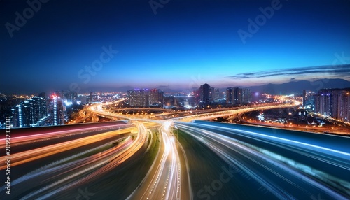 cityscape at night with illuminated highways