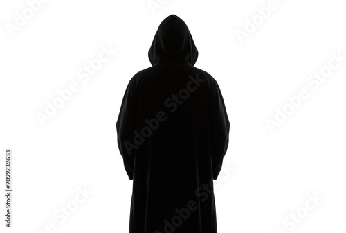 Obraz na płótnie Dark silhouette of hooded figure facing away