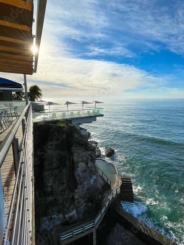Canvas Print Luxury oceanfront resort built on dramatic volcanic cliffs above the Pacific Ocean, featuring infinity terraces, natural tidal pools and panoramic coastal views in El Salvador