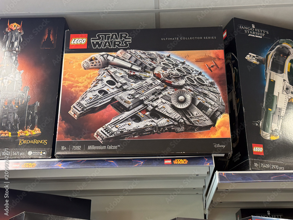 Fototapeta premium Lego star wars millennium falcon box displayed on a store shelf with other collectible building sets