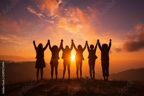 Friends Holding Hands at Sunset for International Day of Friendship, Unity and Togetherness