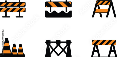 Фотография Orange and black construction barriers and cones for roadwork and safety isolate