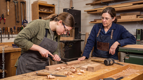 Women Carpenters Practice Tenon Joinery During Vocational Workshop Class