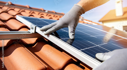 Installing solar panels on a tiled roof for renewable energy generation