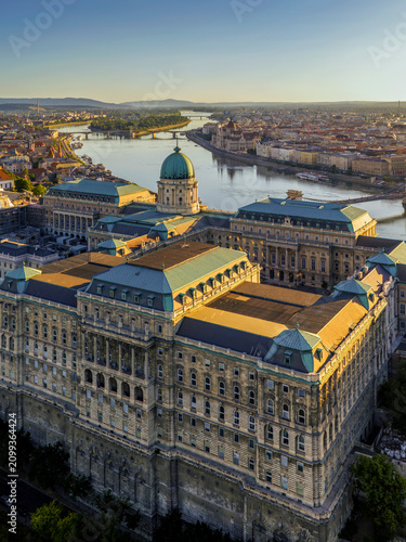 Fotografie A unique aerial view of Buda Castle at sunrise, overlooking the Hungarian Parliament, the Danube, Margaret Island and Margaret Bridge
