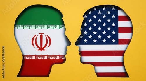 Iran and USA head silhouettes facing each other. Geopolitical concept of international relations.