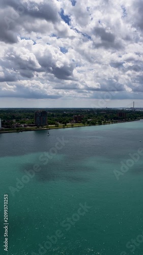 Aerial footage of a gorgeous landscape along the Detroit River in Detroit Michigan USA
