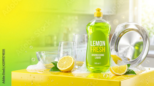 A bright green bottle of lemon dishwashing liquid displayed with clean glasses, plates, fresh lemons, and sparkling water effects.