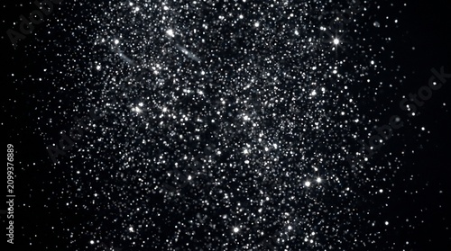 Shimmering silver glitter particles