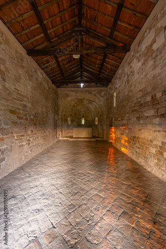 Принти на полотні Ancient Romanesque chapel displaying stone walls and wooden roof