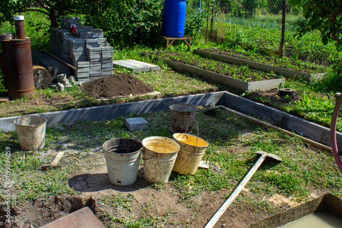 Bild auf Leinwand Строительство мангальной зоны.Construction of a barbecue area.