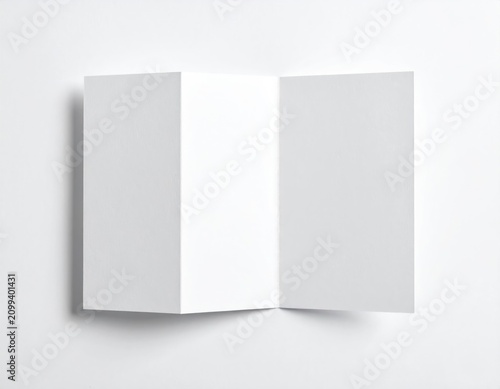 A blank white trifold brochure is opened and presented on a plain white background
