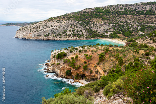Scenic high-angle coastal view with the turquoise waters of Livadi Beach, southeastern coast of Thassos, Northern Greek Aegean Sea
