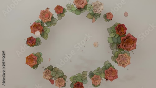 Frames showing roses and leaves assembling into circular wreath on cream table with drifting petals