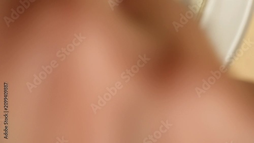 Close-Up of a Hand Dialing a Phone Number on a Vintage Rotary Telephone in Warm Light