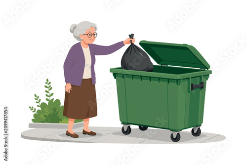 Elderly woman with gray hair and glasses throws a full trash bag into a large green dumpster