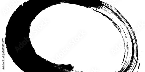 фотографія A stark, black ink brushstroke forms an imperfect circle on a white background, evoking a sense of minimalist zen and meditative calm