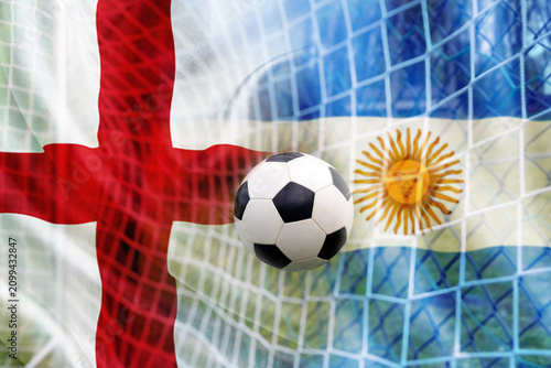 Obraz na płótnie Soccer ball and the flag of England and Argentina