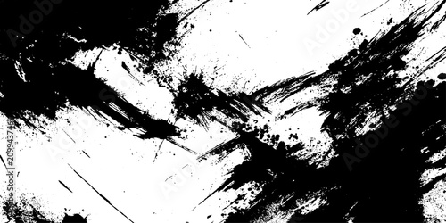 Tableau sur toile Black ink splatters on a white canvas create a dynamic abstract pattern, conveying a sense of raw energy and expressive art