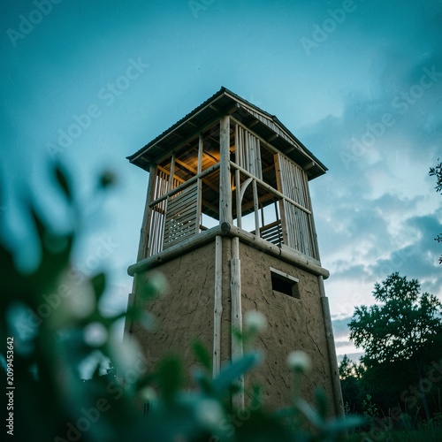 Historic Watchtower Against Dramatic Cloudy Sky.