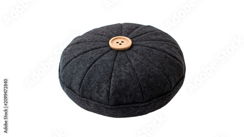 Fotografie Round dark textured sewing pincushion with button isolated on transparent backgr